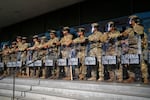 California National Guard stand in formation guarding the federal building in downtown Los Angeles on Tuesday, June 10, 2025.