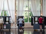 Voters cast ballots in Georgia's primary election at a polling location on May 21, 2024 in Atlanta. Many officials and researchers worry that audio deepfakes of politicians could be used to sway elections this year. 