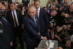 Armenian Prime Minister Nikol Pashinyan, center, casts his ballot at a polling station during the parliamentary election in Yerevan, Armenia, Sunday, June 7, 2026.