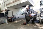 Phil Wheeler and his dog, Nico, share a moment outside his recreational vehicle in Clackamas County on Sept. 20, 2024. Wheeler and his wife, and Nico, recently had to move again after Clackamas County removed people living on the streets on Clackamas Road. The couple had been living there for about two months.