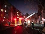 Firefighters work on the scene of a deadly blaze in downtown Johannesburg Thursday, Aug. 31, 2023.