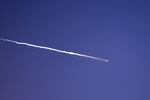 Rocket trails are seen in the sky above the Israeli coastal city of Netanya amid a fresh barrage of Iranian missile attacks on March 28, 2026.