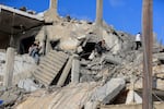 People search for victims at a destroyed building hit in an Israeli airstrike, in Ghaziyeh town, south Lebanon, Sunday, Nov. 3, 2024.