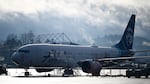 Alaska Airlines N704AL, a 737 Max 9, which made an emergency landing at Portland International Airport on January 5 is parked at a maintenance hanger in Portland, Ore. on January 23, 2024. One of two door plugs on the emergency exit door blew out shortly after the plane took off from Portland.