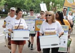 Eugene Clean Energy Fund supporters march through downtown Eugene, July 21, 2026.