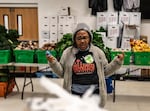 At the No Limits Food Pantry moments before food is distributed, team member Gloria Jarmon, 77 of Landover, MD says a prayer in hopes of having a successful day of giving.