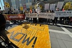 Pro-Palestinian protesters demanding the release of Columbia University graduate student Mahmoud Khalil stand outside his immigration court hearing in Newark, N.J., on Friday, March 28, 2025.