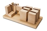 
"With our first concept model, we got the project. The major precept of the concept is there’s space between. You go form one experience and then step into one of those gaps. It’s like a reset for your ears.
But I wanted it to feel like one building. So after doing paper models, digital drawings, it led to this laminated wood model, where you see the original towers that correspond to the first concept model, and the forms morph and touch structurally."