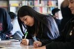 Ali, a junior at Portland's David Douglas High School, fills out an assignment sheet in her English class on September 5, 2023. Ali is part of OPB's Class of 2025 project. 