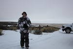 One of the protesters, Dylan Anderson, who gave the name "Captain Moroni," guards the entrance to the refuge. "Moroni" said he was disappointed that more protesters did not arrive after a widespread call on social media.