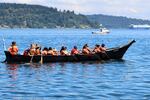 Crew members aboard Sea Foam Dancer, the Pacheedaht First Nation canoe, pull away from shore at Owen Beach, paddling to their final destination in Puyallup on July 31, 2024.