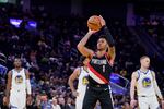 Portland Trail Blazers guard Anfernee Simons (1) shoots a free throw against the Golden State Warriors during the first half of an NBA preseason basketball game in San Francisco, Tuesday, Oct. 11, 2022.
