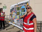 Volunteer Anne Havniear describes some of the planned scenarios playing out during the training exercise, some of which is layed out on the map.