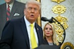 U.S. Attorney General Pam Bondi listens as President Trump speaks in the Oval Office of the White House on Oct. 15.