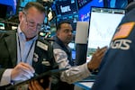 Stocks and cryptocurrencies surged after former President Trump won the presidential election. Pictured are traders working on the New York Stock Exchange in New York on Oct. 22.