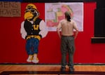 A person looks at a fire evacuation map at Wheeler High School in Fossil, Ore., on Tuesday, July 21, 2026.