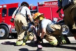 Instructors for the bootcamp led drills that emphasized teamwork, such as learning how to properly load hoses.