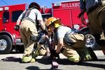 Instructors for the bootcamp led drills that emphasized teamwork, such as learning how to properly load hoses.