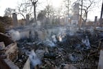 Smoke rises from the charred remains of a structure at the Pasadena Waldorf School campus, Sunday, Jan. 12, 2025, in Altadena, Calif.