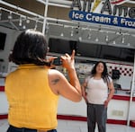 Jessica Rubio, poses for a portrait for her mom, Sophia Barajas two days before the mall's closure on Aug. 6, 2026. Barajas says one of her first jobs was at the Macy's in the Lloyd Center when she was pregnant with Rubio. They were visiting the mall for the last time before it closes to the public.