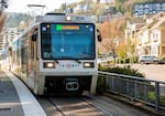 A TriMet Green Line MAX train approaches a station in southwest Portland, Ore., on Friday, March 20, 2020. The public transportation agency reported widespread dips in ridership due to the ongoing coronavirus pandemic.