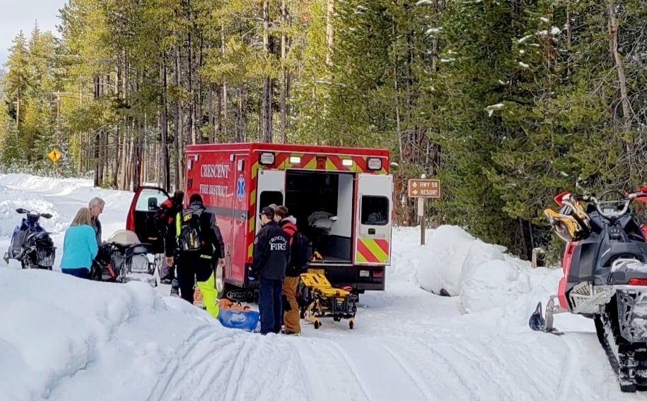 First responders load Erik Kerr into an ambulance after a snowmobiling crash on Jan. 1, 2023.