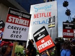 Striking Writers Guild members picket alongside SAG-AFTRA members outside Netflix studios in September 2023. 