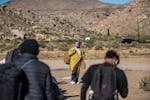 Migrants say Border Patrol tells them that if they leave the camps, they will get deported.  