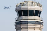 An American Airlines Airbus A319 airplane takes off past the air traffic control tower at Ronald Reagan Washington National Airport in Arlington, Va., in January.