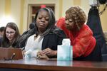 Shaye Moss, a former Georgia election worker, is comforted by her mother, Ruby Freeman, as Moss testifies during a hearing of the Jan. 6 Committee on June 21.