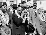 Civil rights activist Martin Luther King Jr marching from Selma to Montgomery, Alabama alongside Rabbi Abraham Joshua Heschel.