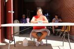 Tiana Northrup of Warm Springs greets people who come to pick up water from an emergency distribution center on the Warm Springs Reservation, Aug. 2, 2019.