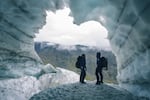Explorers just inside the entrance of the Pallin Glacier tunnel in northern Sweden.