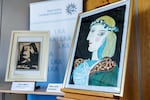 Two forged artworks purportedly by the Spanish artist Pablo Picasso are seen during a presentation at the Bavarian State Criminal Investigation Department in Munich on Friday.