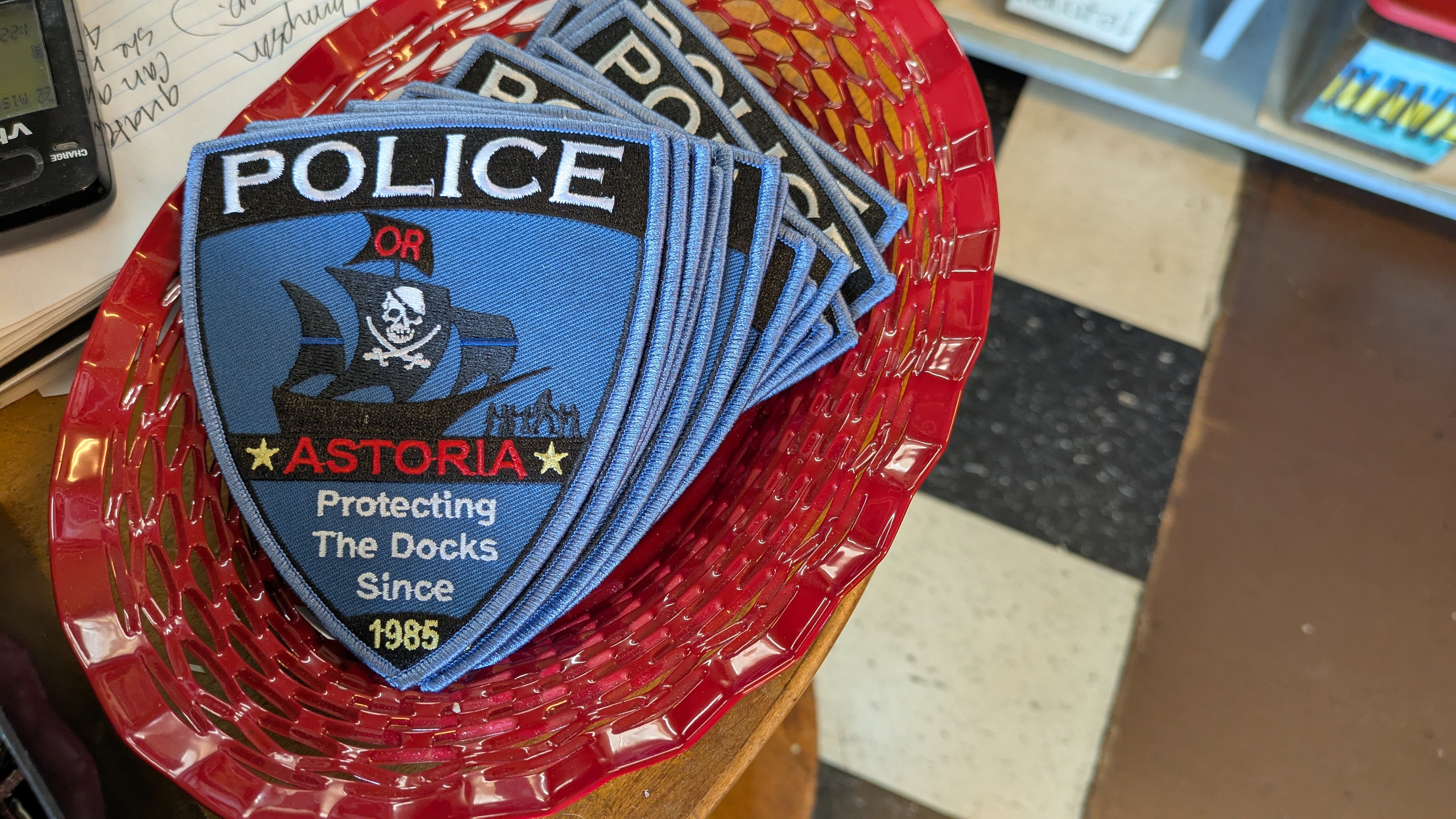 The Astoria Coffee Company, located just down the road from the famous Goonies House, sells Goonies merchandise and is bracing for a busy weekend during the 40th anniversary. These badges were available for sale at the coffee shop on Thursday. May 22.