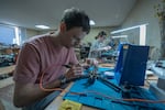 Oleh Halaidych, 34, scientist, documentary filmmaker, volunteer solder fpv dron in workshop in Kyiv on March 21, 2025
