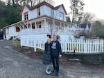 Behman and Liz Zakeri are pictured in January 2023, in front of their new home in Astoria, which was used in the filming of the 1985 cult classic "The Goonies."