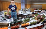 Michael Lavrich prepares for the holiday train show at the Deschutes County Public Library. Dec. 14, 2023.