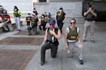 FBI officers are seen here taking a knee as demonstrators marched in June 2020, in Washington, D.C., during a protest over the death of George Floyd, a Black man who died after a police officer kneeled on his neck for several minutes.