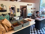 Josh Fairbanks prepares bread and bagel orders at his Fairbanks Bread pop-up in Portland, Ore. on June 1, 2026. He turned a 2021 pop-up into a thriving business, saying the pandemic gave him the audacity to try something new.