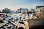 Homes are surrounded by debris in Kwigillingok, Alaska, Monday, Oct. 27, 2025, after being damaged earlier in the month by Typhoon Halong.