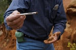 Geologist Robert Osborne shows magnetic laterite soil near Homeland Nickel's Red Flat claim in Curry County in June of 2026.