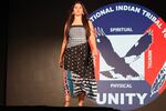 A model wears a dress designed by Red Berry Woman for the pre-gala fashion show at the UNITY Conference on July 2.