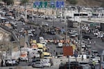 Israeli police and rescue teams respond at the scene of a shooting attack where several people killed and injured in Jerusalem, Monday, Sept. 8, 2025.