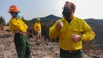 OSU wildfire scientists Meg Krawchuk (left) and Chris Dunn (right) examine the damage done by the Holiday Farm Fire to private timberland.