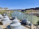 Under a sunny blue sky, a high angle view of Lower Salmon Falls Dam near Hagerman.