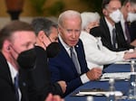 President Biden, center, talks with Secretary of State Antony Blinken at the start of the meeting with the Chinese delegation. Also seen here are National Security Adviser Jake Sullivan, left, and Treasury Secretary Janet Yellen, right.