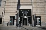Workers removed the sign at the U.S. Agency for International Development building on February 7.