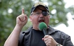 In this Sunday, June 25, 2017 file photo, Stewart Rhodes, founder of the citizen militia group known as the Oath Keepers speaks during a rally outside the White House in Washington. Rhodes, an Army veteran who founded the Oath Keepers in 2009 as a reaction to the presidency or Barack Obama, had been saying for weeks before the Jan. 6, 2021 Capitol riot that his group was preparing for a civil war and was "armed, prepared to go in if the president calls us up."