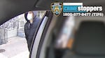 This undated photo released by the New York Police Department shows a suspect in the fatal shooting of UnitedHealthcare CEO Brian Thompson on Dec. 4, 2024, outside of a taxi. Part of the image was blurred by the source. (NYPD via X)